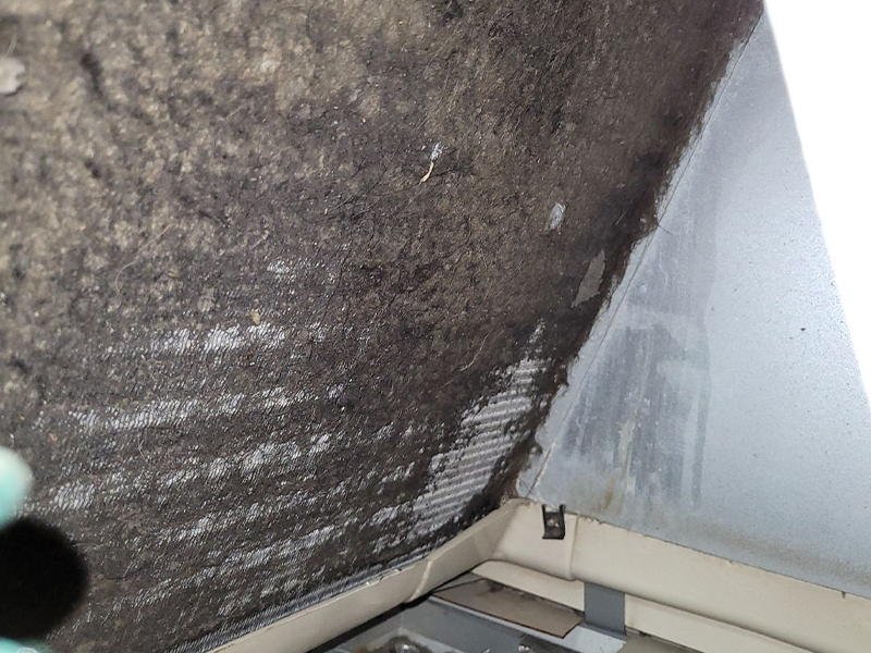 This image shows a dirty air conditioning filter.
